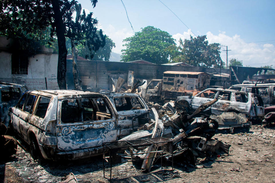 The charred remains of vehicles  (Clarens Siffroy / AFP - Getty Images)