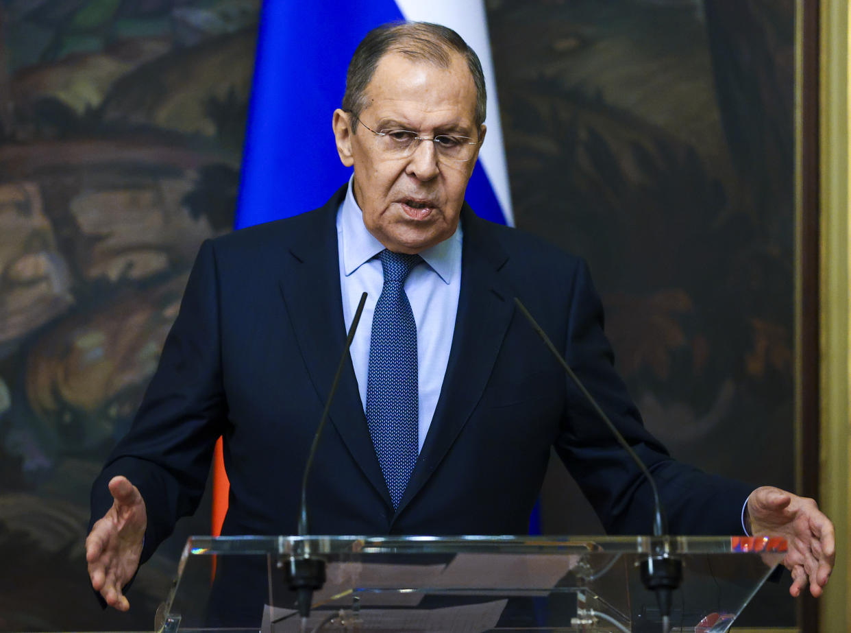 In this handout photo released by Russian Foreign Ministry Press Service, Russian Foreign Minister Sergey Lavrov gestures while speaking during a joint news conference with and German Foreign Minister Annalena Baerbock following their talks in Moscow, Russia, Tuesday, Jan. 18, 2022. (Russian Foreign Ministry Press Service via AP)