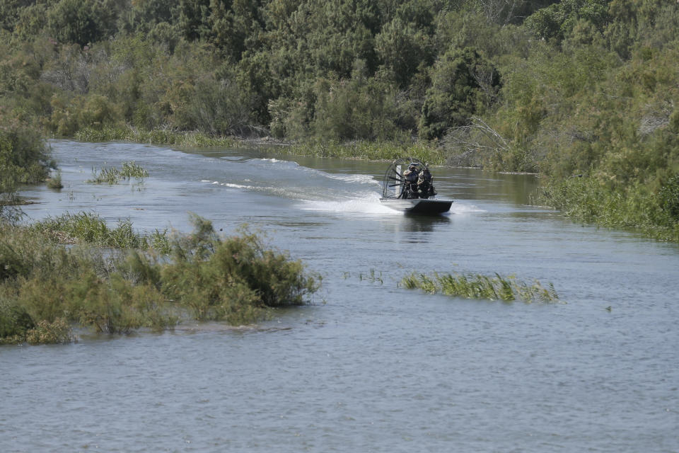 A US Border Patrol boat moves up the Colorado River during a ceremony Thursday, March 27, 2014, Los Algodones, Mexico.Colorado River water has begun pouring over a barren delta near the U.S.-Mexico border, the result of a landmark bi-national agreement being celebrated Thursday. (AP Photo/Gregory Bull)