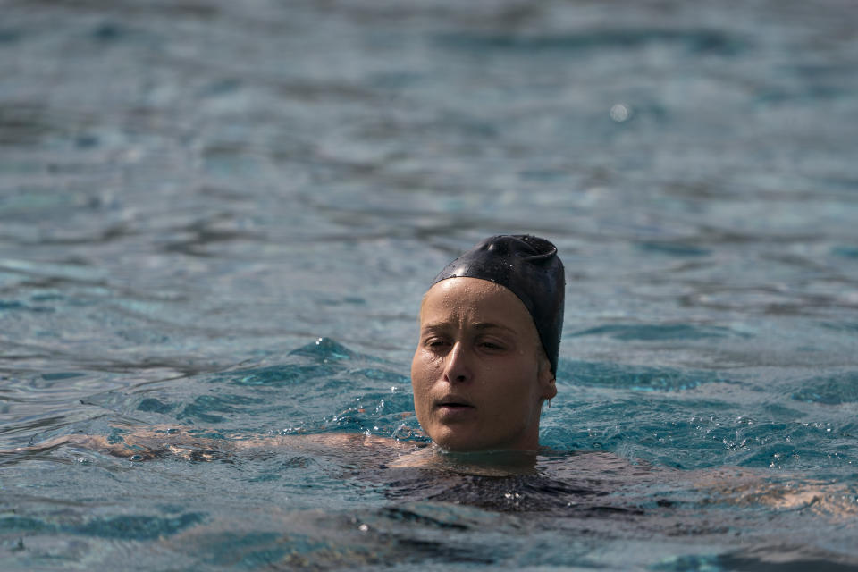 Stephania Haralabidis, a member of the U.S. women's water polo team, trains at MWR Aquatic Training Center Tuesday, April 27, 2021, in Los Alamitos, Calif. Haralabidis, 26, is among five newcomers on the U.S. squad heading to the Tokyo Games this summer. The 13-player roster was announced Wednesday, June 23, 2021, in Los Angeles.(AP Photo/Jae C. Hong)