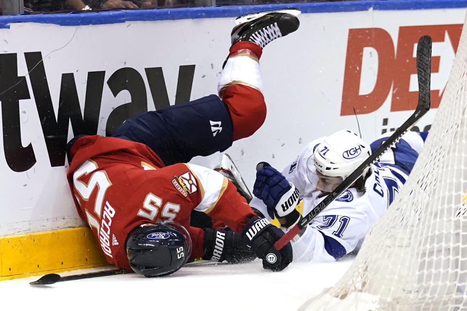 Florida Panthers center Noel Acciari (55) and Tampa Bay Lightning center Anthony Cirelli (71) fall to the ice during the first period in Game 5 of an NHL hockey Stanley Cup first-round playoff series, Monday, May 24, 2021, in Sunrise, Fla. (AP Photo/Lynne Sladky)