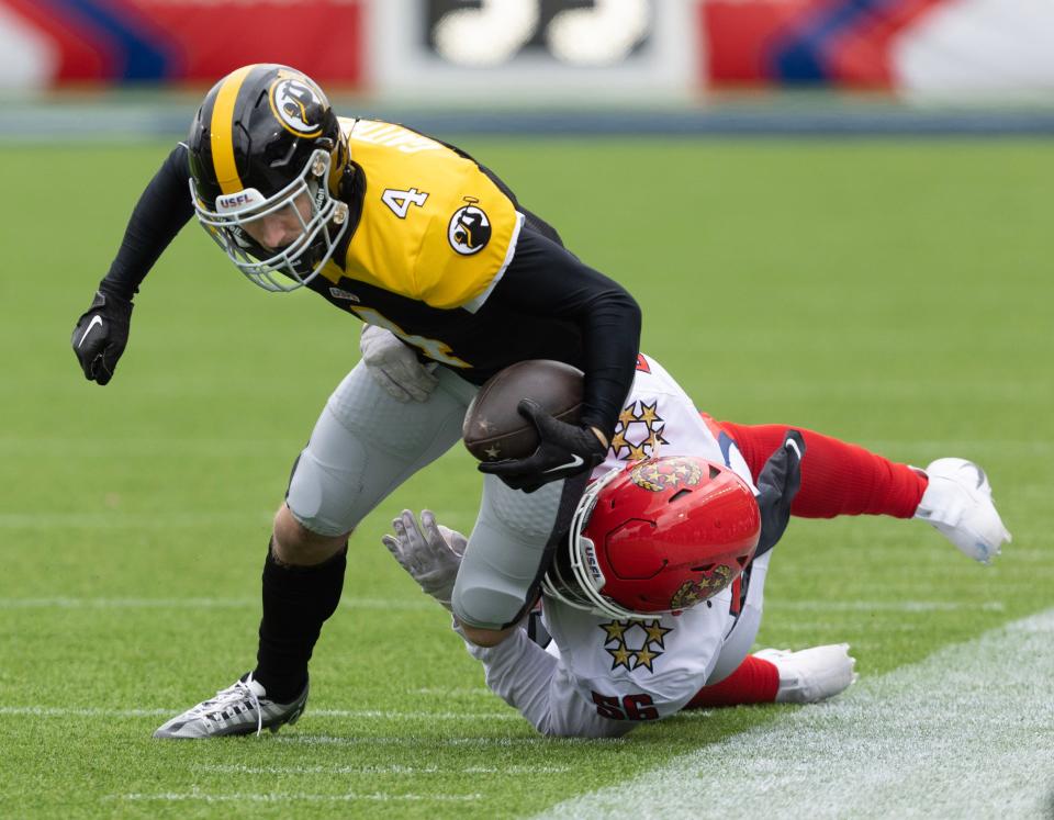 New Jersey Generals defender Bryson Young works to bring down Pittsburgh Maulers receiver Bailey Gaither in the first half, Sunday, April 23, 2023, in Canton.