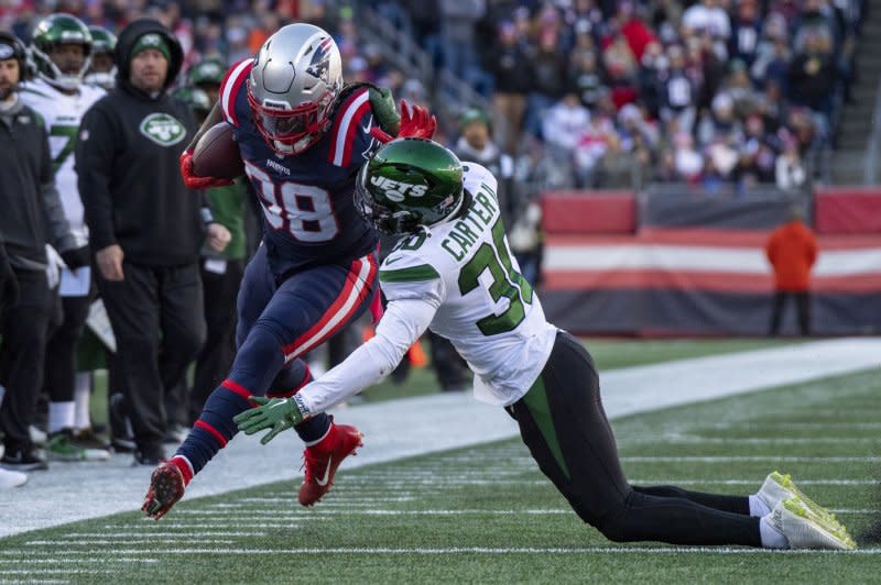 New England Patriots running back Rhamondre Stevenson (L) sustained an ankle injury in a loss tot he Los Angeles Chargers. File Photo by Amanda Sabga/UPI