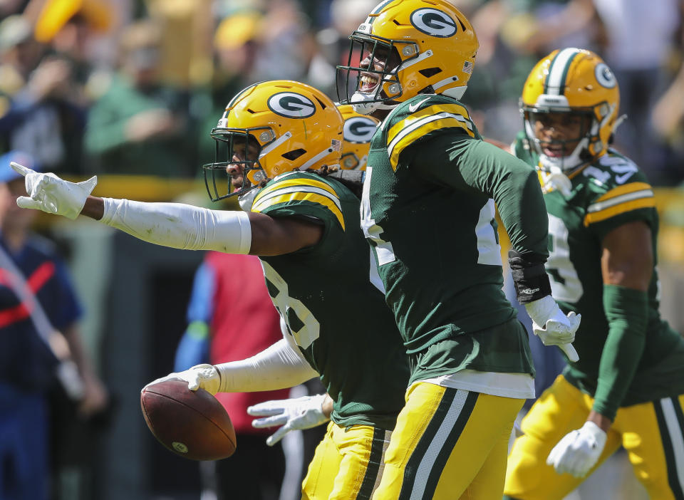 Aug 26, 2023; Green Bay, WI, USA; Green Bay Packers safety Benny Sapp III (pointing) and linebacker Tariq Carpenter (24) celebrate after Sapp’s interception against the <a class="link " href="https://sports.yahoo.com/nfl/teams/seattle/" data-i13n="sec:content-canvas;subsec:anchor_text;elm:context_link" data-ylk="slk:Seattle Seahawks;sec:content-canvas;subsec:anchor_text;elm:context_link;itc:0">Seattle Seahawks</a> during their preseason football game at Lambeau Field. Green Bay defeated Seattle 19-15. Mandatory Credit: Tork Mason-USA TODAY Sports