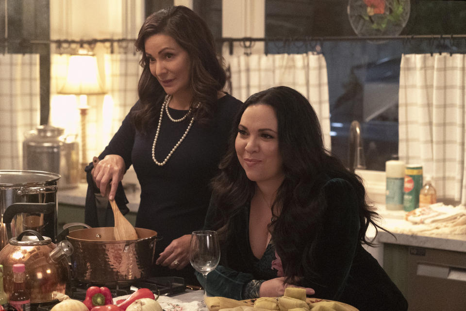 This image released by Amazon shows Constance Marie, left, and Gloria Calderon Kellett in a scene from the series "With Love." (Kevin Estrada/Amazon via AP)