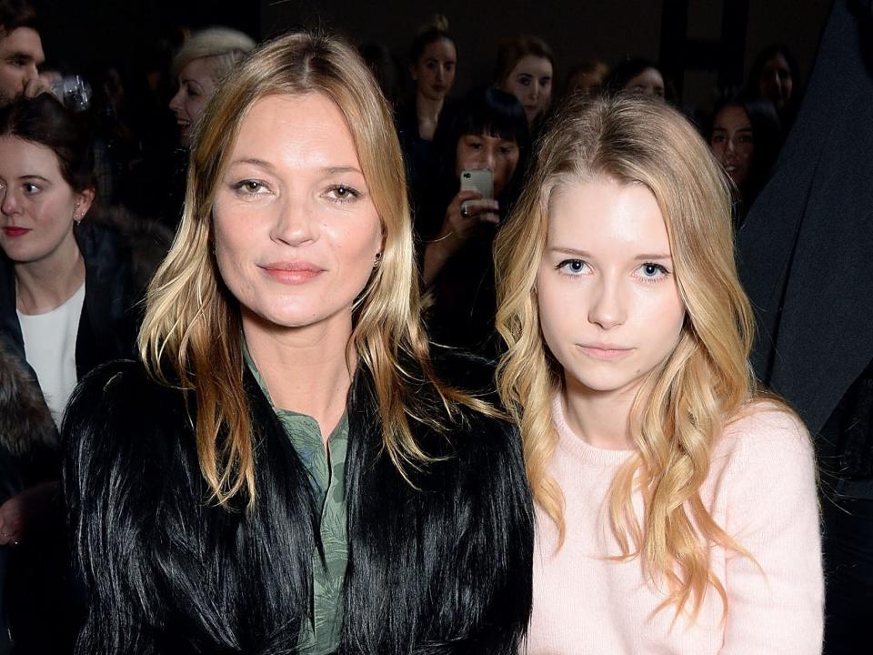 Kate Moss and Lottie Moss attend the Topshop Unique show at London Fashion Week AW14 at Tate Modern on February 16, 2014 in London, England.