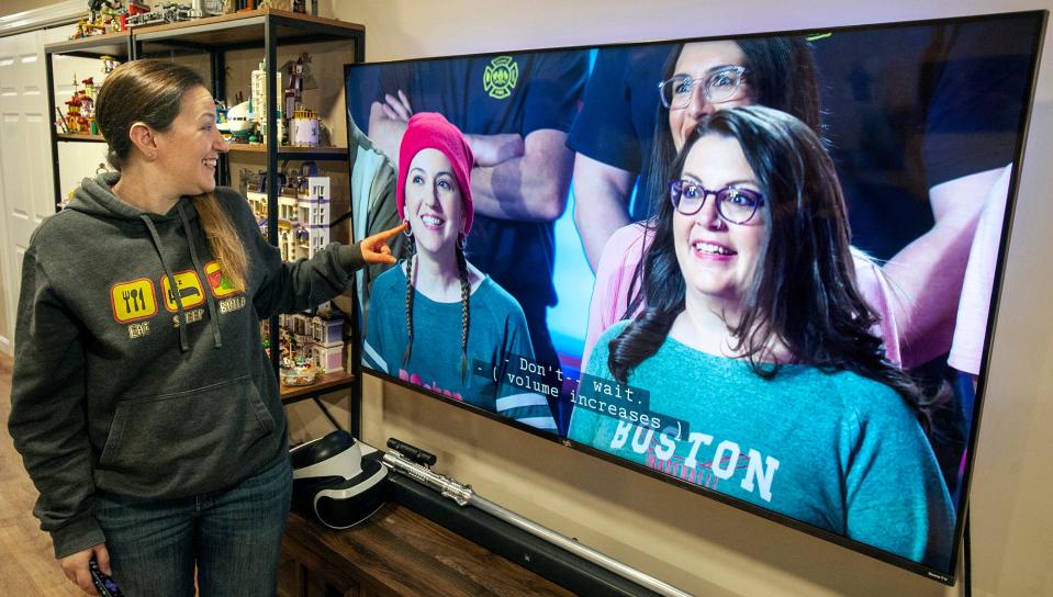 Liz Puleo, of Hudson, a contestant on the Fox television show "Lego Masters," views a recording of one of the shows in the family basement, Oct. 3, 2022.