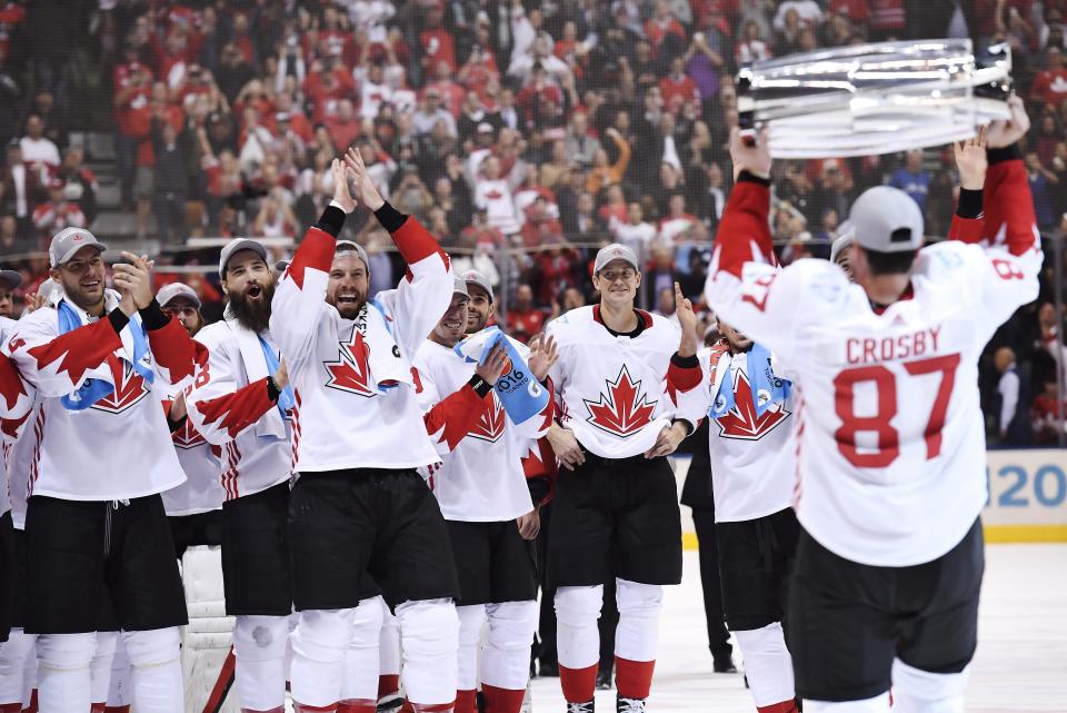 FILE - Canada's Sidney Crosby (87) hoists the trophy in front of teammates following Canada's 2-1 victory over Europe in Game 2 of the final to win the World Cup of Hockey, in Toronto, Sept. 29, 2016. (Frank Gunn/The Canadian Press via AP, File)