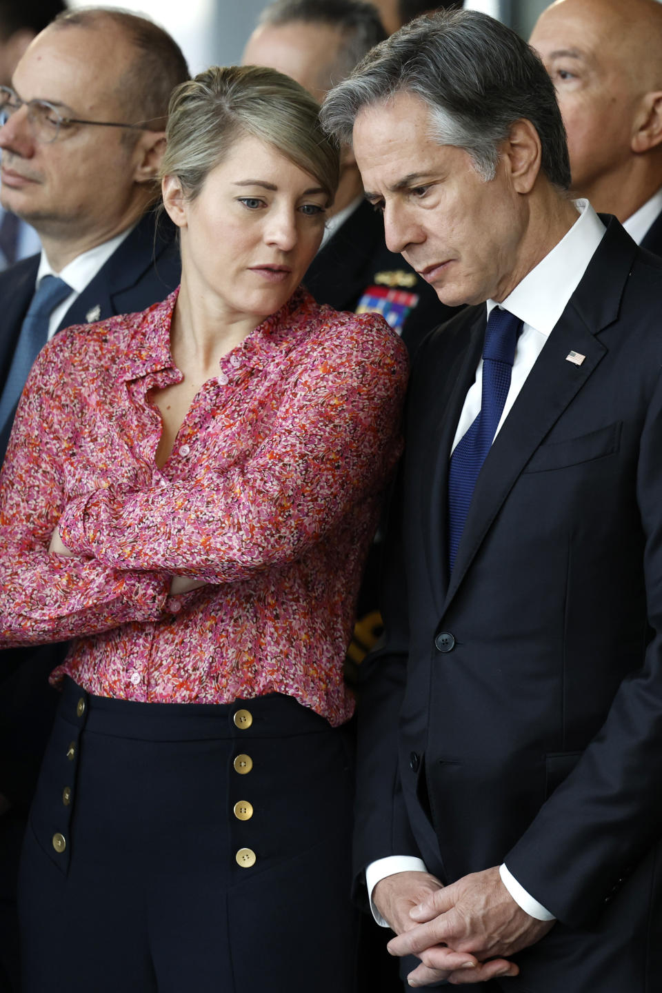 Canada's Foreign Minister Melanie Joly, left, speaks with United States Secretary of State Antony Blinken as they attend a ceremony to mark the 75th anniversary of NATO at NATO headquarters in Brussels, Thursday, April 4, 2024. NATO marked on Thursday 75 years of collective defense across Europe and North America, with its top diplomats vowing to stay the course in Ukraine as better armed Russian troops assert control on the battlefield. (AP Photo/Geert Vanden Wijngaert)