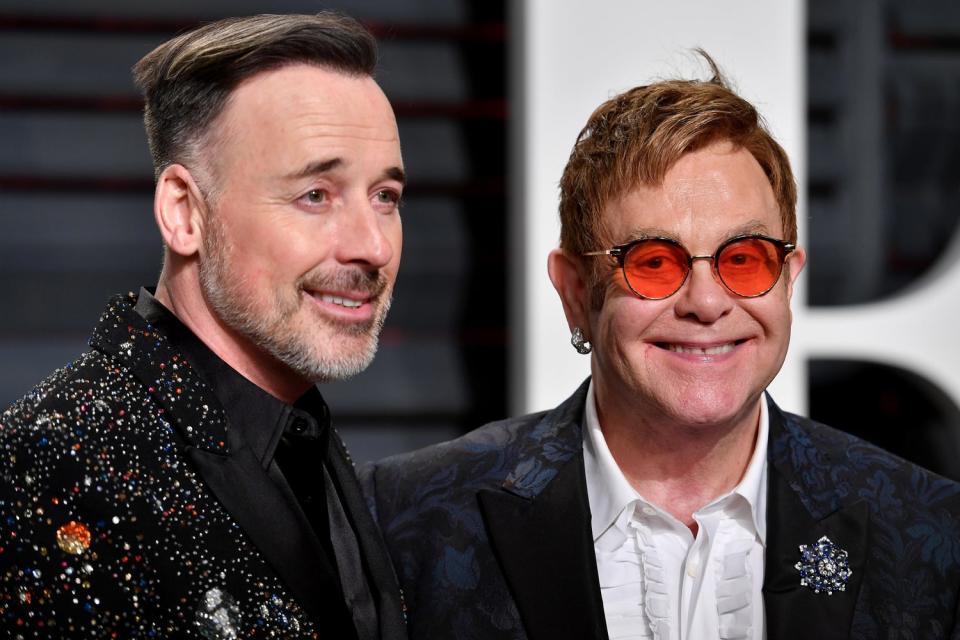 <p> Sir Elton John with his husband David Furnish</p> (Pascal Le Segretain/Getty)