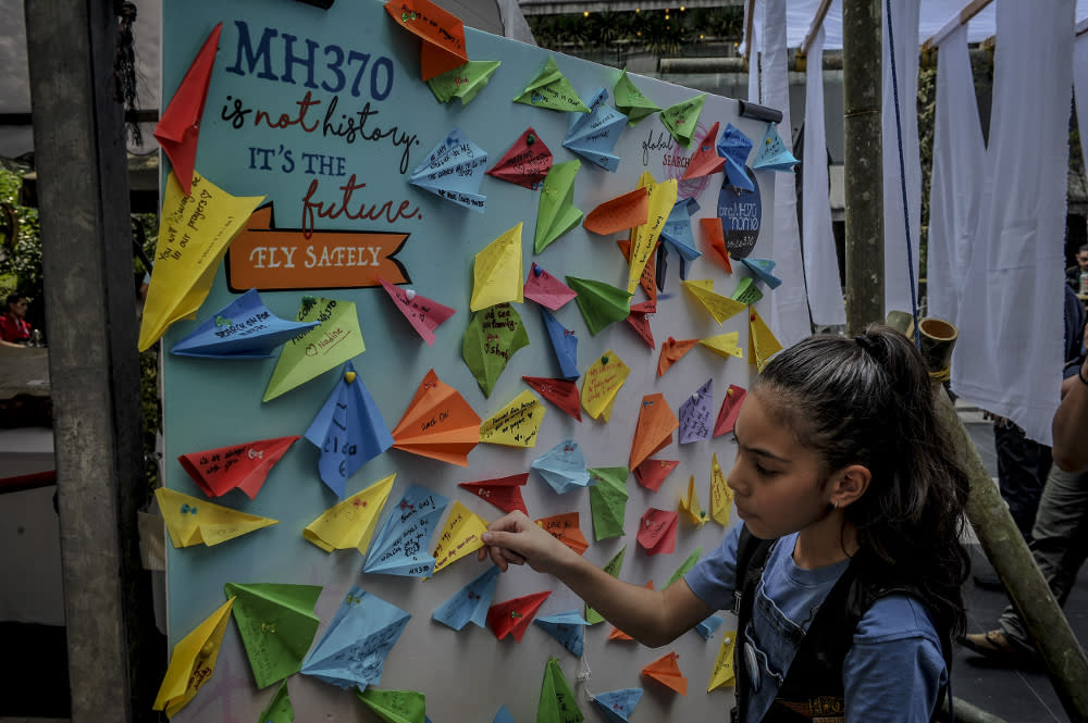 Messages written on paper planes are displayed during the remembrance ceremony to mark the 5th anniversary of MH370’s disappearance in Kuala Lumpur March 3, 2019. — Picture by FIrdaus Latif