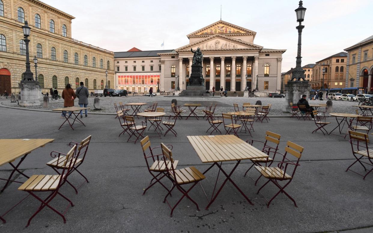 MUNICH, GERMANY - OCTOBER 31: Empty chairs and tables stand outside a restaurant in front of the opera house where wearing masks is mandatory during the second wave of the coronavirus pandemic on October 31, 2020 in Munich, Germany. The German government recently announced that effective this coming Monday, November 2, all restaurants, bars, cultural venues, cinemas, fitness studios and sports halls must close for four weeks in an effort to rein in the skyrocketing growth in the number of daily infections that recently reached 18,000. Stores, schools and day care centers will remain open. (Photo by Andreas Gebert/Getty Images) - Andreas Gebert/Getty Images Europe