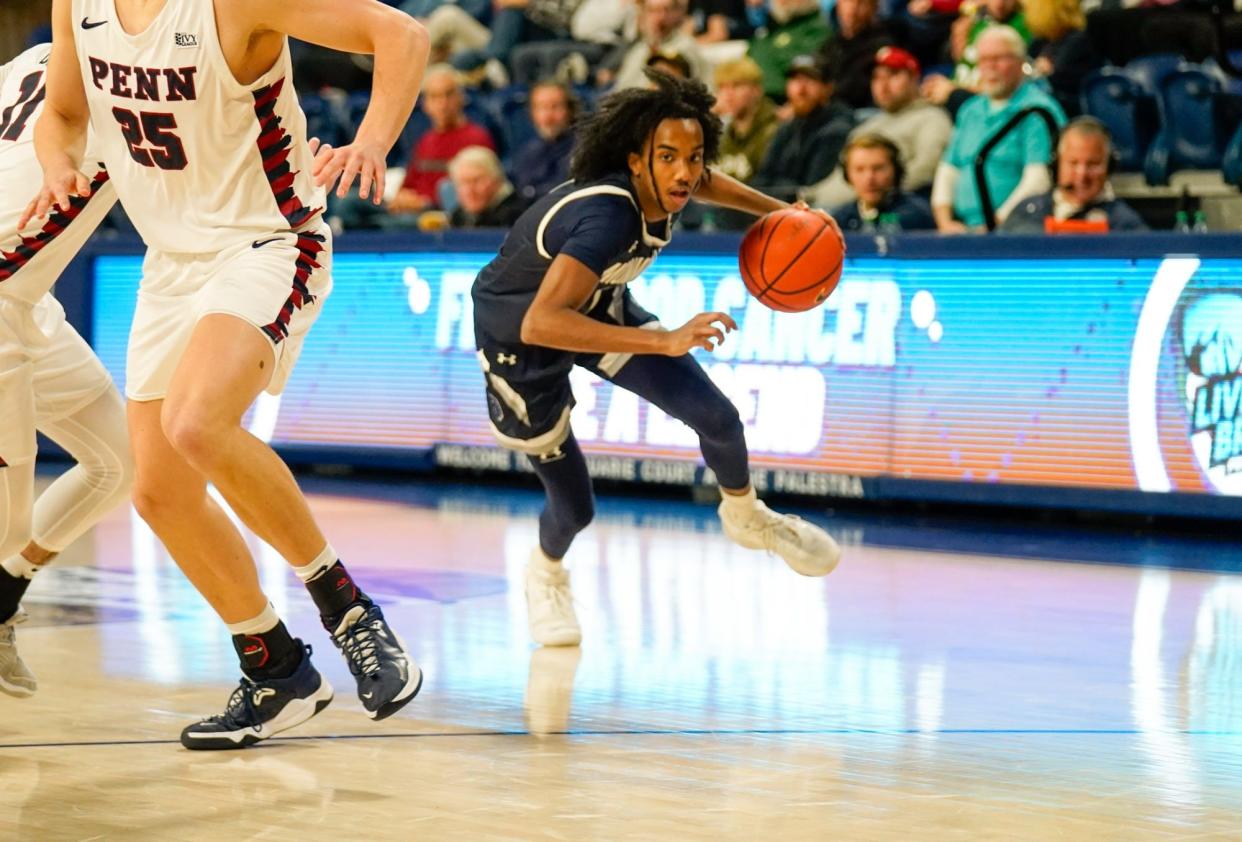 Monmouth guard Abdi Bashir Jr. looks for an opening against Penn at the Palestra in Philadelphia on Nov. 26, 2023.