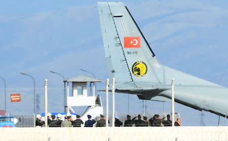 The coffin of the pilot killed when Turkey shot down a Russian jet is carried to a Turkish Air Force Cargo Aircraft, before being handed over to Russia, on the tarmac of the Hatay Airport in Hatay, Turkey, November 29, 2015. REUTERS/Stringer