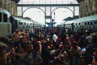 Migrants and refugees crowd the platforms at the Keleti (eastern) railway station in Budapest on September 1, 2015