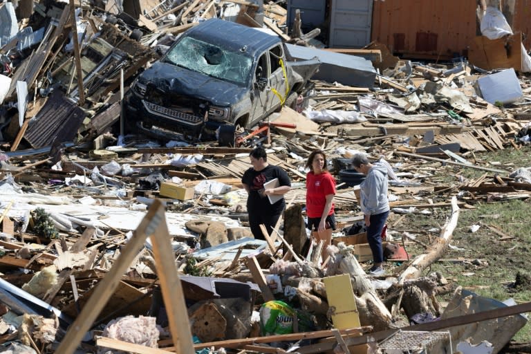 Residents go through the damage after a tornado tore through Greenfield, Iowa (SCOTT OLSON)