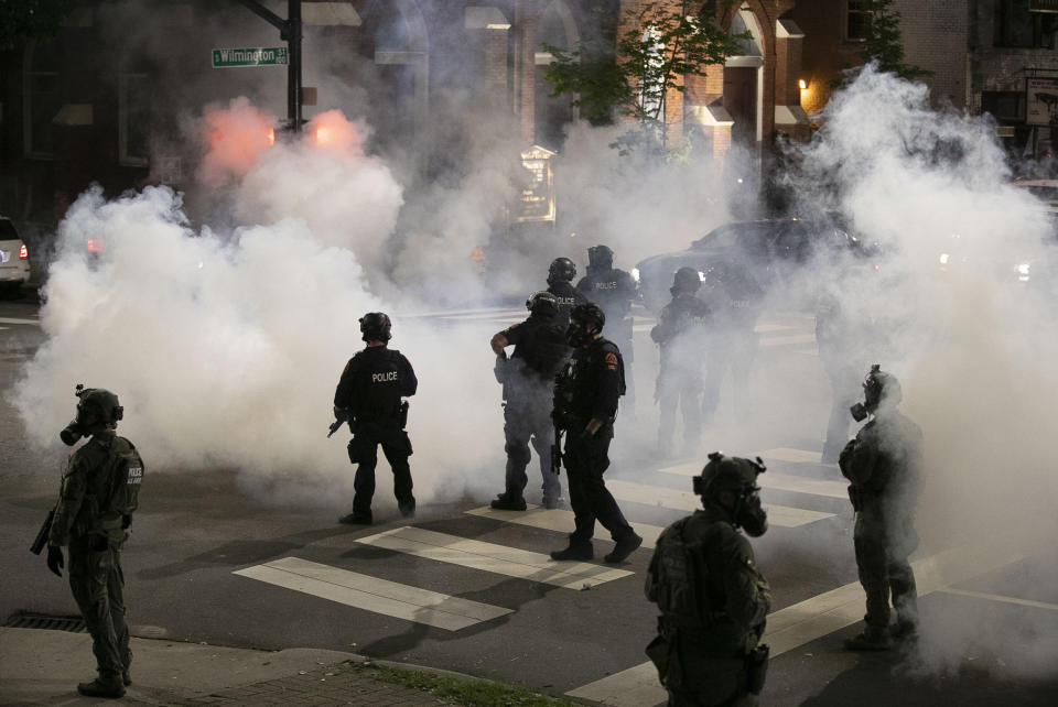 Police in Raleigh, North Carolina, fire tear gas to disperse a crowd of demonstrators in front of the First Baptist Church early Sunday morning. (Photo: Raleigh News & Observer via Getty Images)