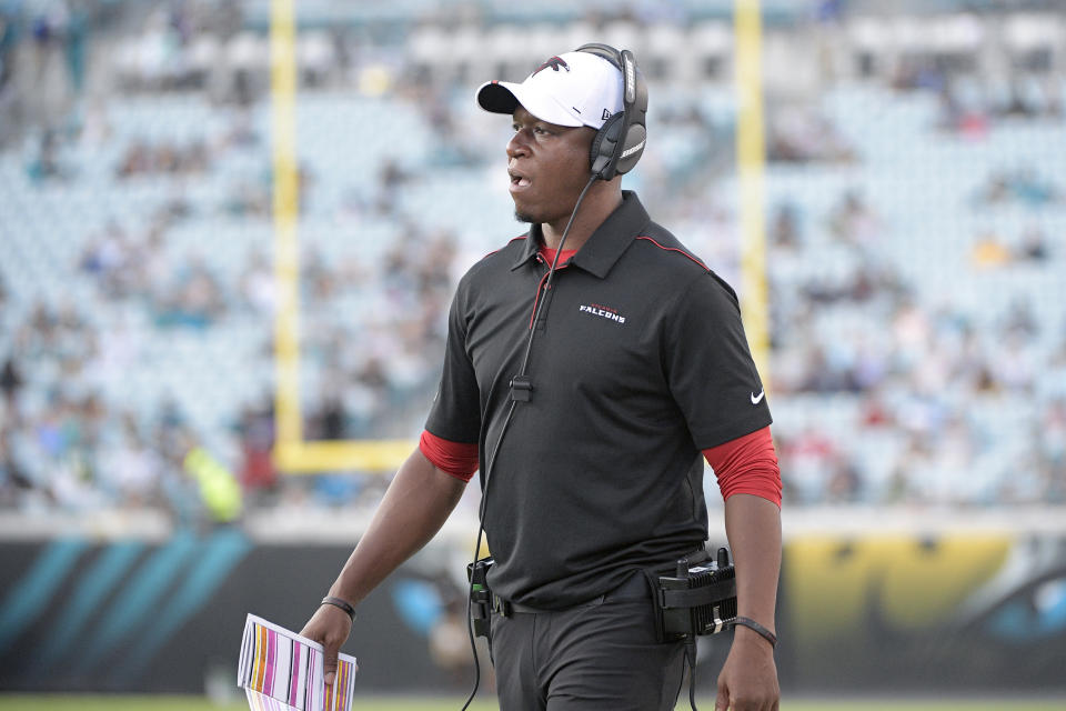 FILE - In this Aug. 29, 2019, file photo, Atlanta Falcons' Raheem Morris watches from the sideline during the first half of a preseason NFL football game against the Jacksonville Jaguars, in Jacksonville, Fla. Morris is returning to his roots as a defensive coach. The Falcons hope the move will help save their season. After 3½ seasons working with the receivers on the offensive side, Morris is now in charge of the struggling secondary. “You do whatever is required for the team,’” Morris said. (AP Photo/Phelan M. Ebenhack, File)