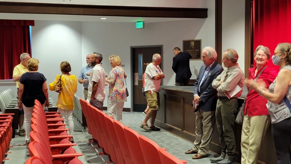 People mingle in the Hendersonville High School auditorium that is home to the Tom Orr Stage on Aug. 3 following the ribbon cutting to celebrate the renovations to the school.