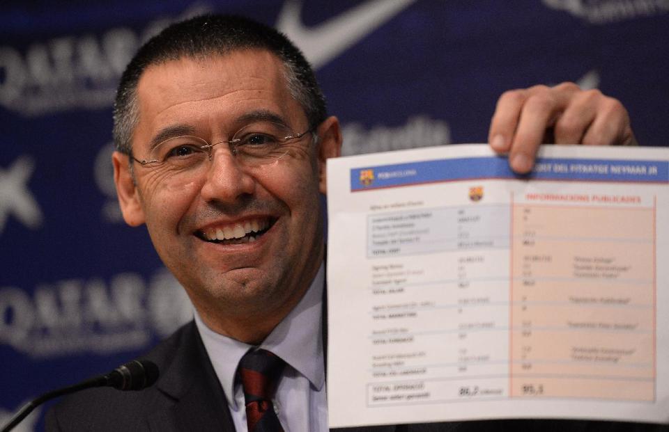 FC Barcelona's president Josep Maria Bartomeu shows a paper with detaitls of the contract of Neymar at the Camp Nou stadium in Barcelona, Spain, Friday, Jan 24, 2014. Barcelona says its board of directors is calling an ''extraordinary'' meeting, fueling Spanish media reports that club president Sandro Rosell is under pressure to consider stepping down due to the lawsuit regarding Neymar's transfer. Barcelona said in a statement that the meeting will take place on Thursday afternoon, a day after a judge agreed to hear a lawsuit brought by a Barcelona club member over the cost of Neymar's signing. (AP Photo/Manu Fernandez)