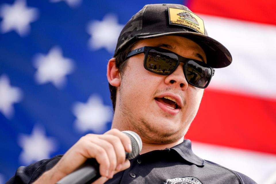 Kyle Rittenhouse, center, speaks during the 'Defend our 2A: Michigan's Right for Self Preservation' event on Wednesday, July 19, 2023, at Freedom Farms in Ionia Township.