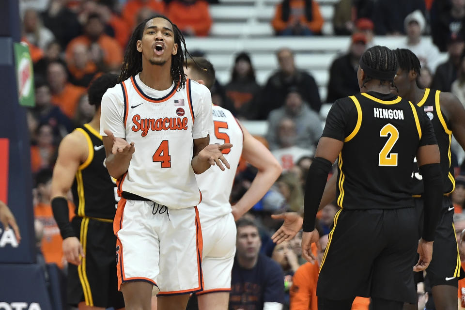 Syracuse forward Chris Bell (4) reacts after a foul during the second half of an NCAA college basketball game against Pittsburgh in Syracuse, N.Y., Saturday, Dec. 30, 2023. (AP Photo/Adrian Kraus)