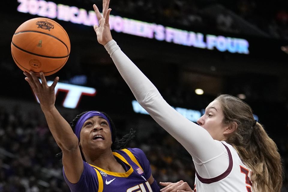 LSU's Alexis Morris shoots past Virginia Tech's Elizabeth Kitley during the first half of an NCAA Women's Final Four semifinals basketball game Friday, March 31, 2023, in Dallas. (AP Photo/Tony Gutierrez)