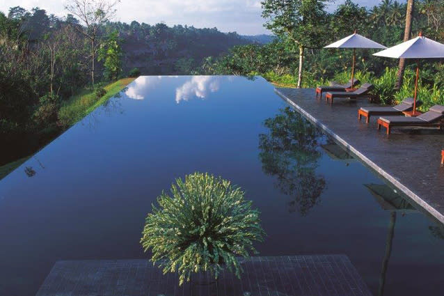 Infinity pool at Alila Ubud, Bali. This hotel is located high in the central foothills of Bali. Its deep-green infinity pool not only blends into the lush landscape but almost seems to extend out right over the edge of the hill. (www.alilahotels.com/ubud)