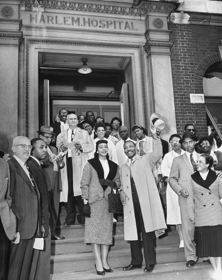 MLK and Coretta Scott King outside of Harlem Hospital