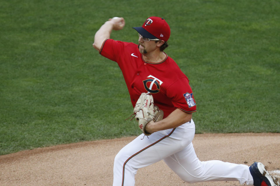 Minnesota Twins pitcher Randy Dobnak throws against the Cleveland Indians in the first inning of a baseball game Friday, July 31, 2020, in Minneapolis. (AP Photo/Jim Mone)