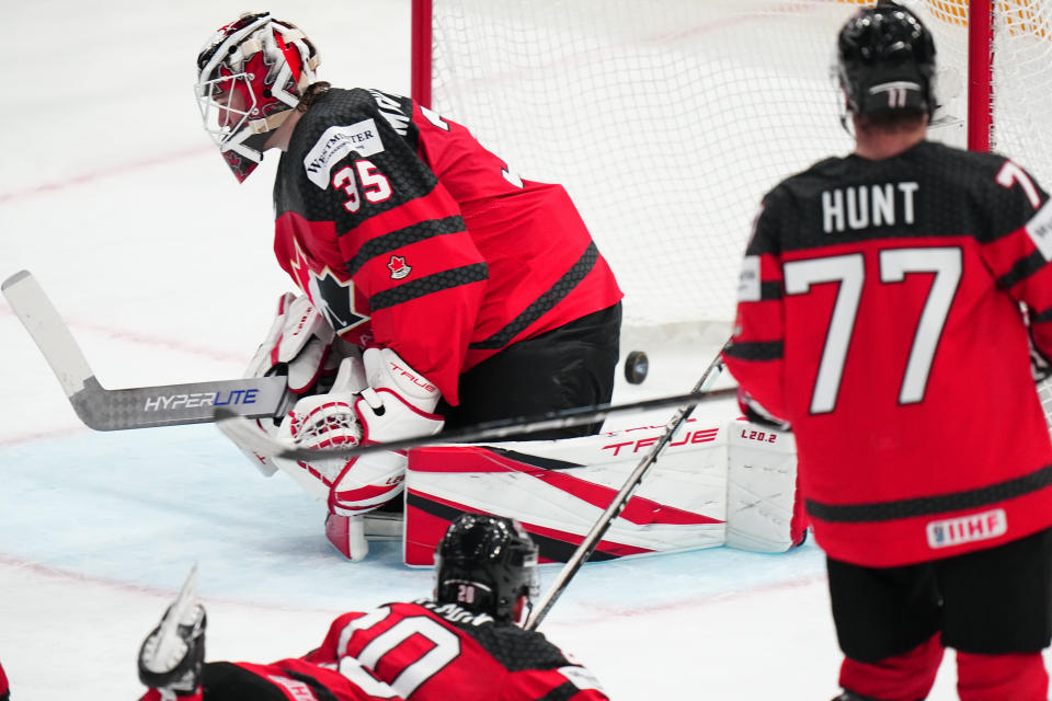 Canada's goalie Samuel Montembeault (35) can't stop the puck on a goal by Germany's Daniel Fischbuch during the gold medal match at the Ice Hockey World Championship in Tampere, Finland, Sunday, May 28, 2023. (AP Photo/Pavel Golovkin)