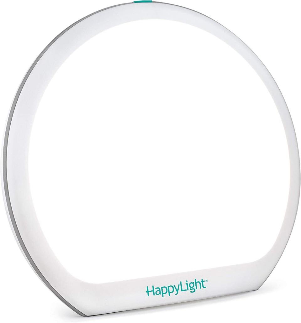 <div><p>"Light matters," Huntley said. "If you find yourself particularly affected by lack of sunlight, you may want to invest in a <a href="https://www.amazon.com/New-Verilux%C2%AE-HappyLight%C2%AE-Lumi-Plus/dp/B08BCLLYN5/" rel="nofollow noopener" target="_blank" data-ylk="slk:HappyLight;elm:context_link;itc:0;sec:content-canvas" class="link ">HappyLight</a> for some at-home light therapy."This full-spectrum light therapy lamp has four brightness levels and three color temperature options.</p><p><i>You can buy the <a href="https://www.amazon.com/New-Verilux%C2%AE-HappyLight%C2%AE-Lumi-Plus/dp/B08BCLLYN5/" rel="nofollow noopener" target="_blank" data-ylk="slk:HappyLight Therapy Lamp;elm:context_link;itc:0;sec:content-canvas" class="link ">HappyLight Therapy Lamp</a> from Amazon for around $40. </i></p></div><span> Amazon</span>