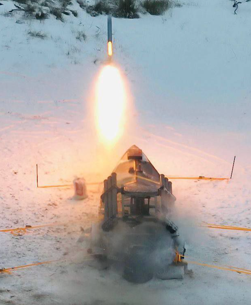 A rear view of a Sea Baby USV launching a Grad rocket while chained down during tests on land. <em>SBU</em>
