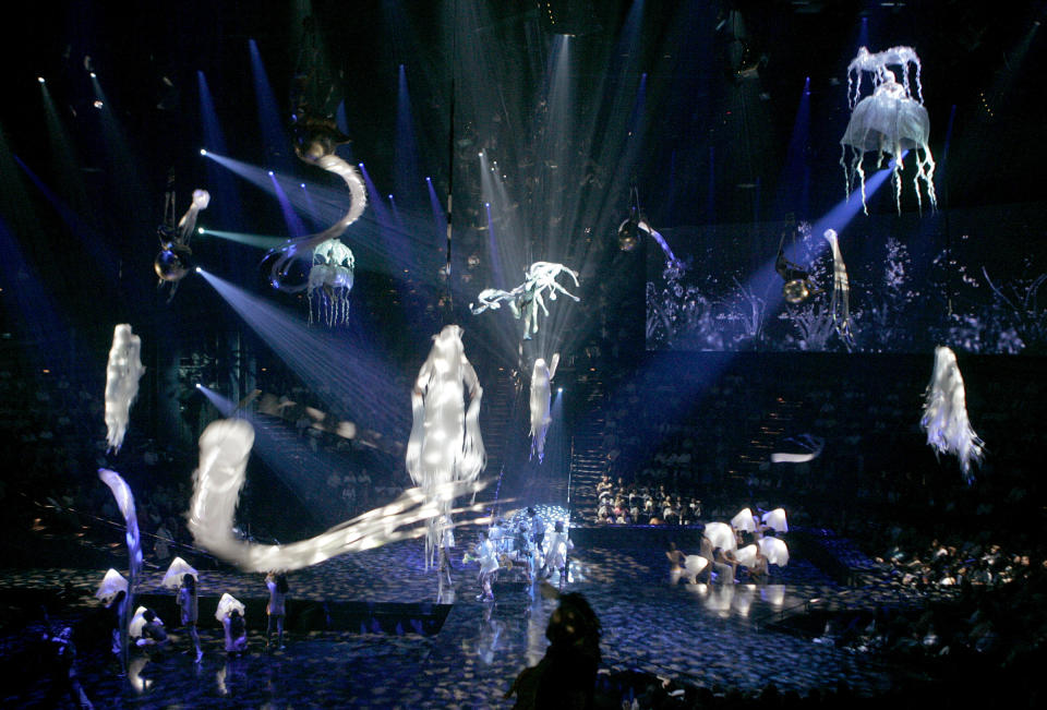 FILE - Acrobats perform during the preview of "Love," a new Beatles-themed Cirque du Soleil show, in Las Vegas, June 27, 2006. On Tuesday, April 9, 2024, it was announced that the final curtain will come down July 7 on Cirque du Soleil's long-running show “The Beatles Love," a cultural icon on the Las Vegas Strip that brought band members Paul McCartney and Ringo Starr back together for public appearances throughout its 18-year run. (AP Photo/Jae C. Hong, File)