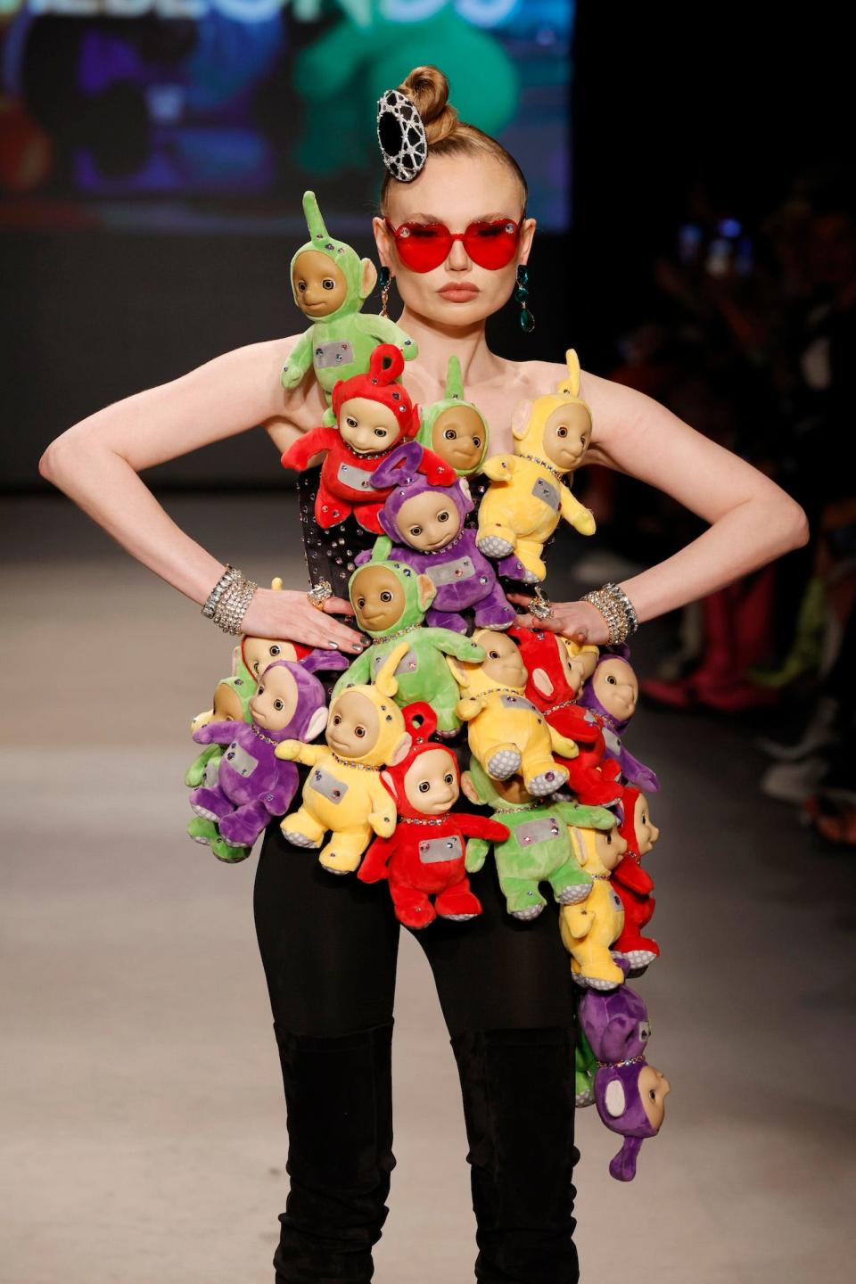 A model for The Blonds wears a "Teletubbies" jumpsuit at Miami Swim Week 2023.