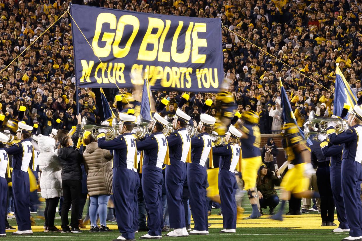 Michigan Wolverines players take the field for the game against the Indiana Hoosiers at Michigan Stadium, Nov. 6, 2021.