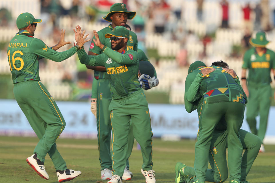 South African players celebrate the dismissal of Australia's Glenn Maxwell during the Cricket Twenty20 World Cup match between South Africa and Australia in Abu Dhabi, UAE, Saturday, Oct. 23, 2021. (AP Photo/Kamran Jebreili)