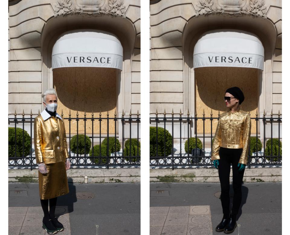 Wearing Prada and Comme des Garçons in front of the Versace store.