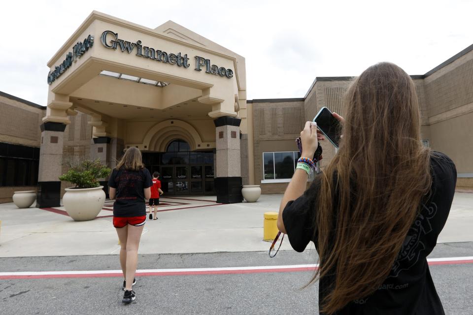 Brinley Rawson, a 17-year-old “Stranger Things” fan from Gwinnett County, snaps a photo of the Gwinnett Place Mall in Duluth, Ga. The mall heavily featured in the latest season of Netflix’s “Stranger Things” is going up for sale.