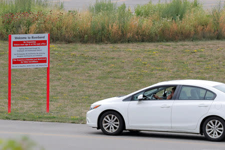 A car arrives at the Tesla Inc. Gigafactory 2, which is also known as RiverBend, a joint venture with Panasonic to produce solar panels and roof tiles in Buffalo, New York, U.S., August 3, 2018. REUTERS/Brendan McDermid/Files