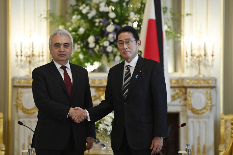 Executive Director of the International Energy Agency (IEA) Dr. Fatih Birol, left, poses with Japan's Prime Minister Fumio Kishida prior to their bilateral meeting at the Akasaka Palace State Guest House in Tokyo, Monday, Sept. 26, 2022. Birol is visiting Japan within the state funeral for former Prime Minister Shinzo Abe that will be held on September 27, in the capital of Japan. (David Mareuil/Pool via AP)