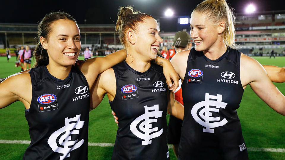 Carlton AFLW players Brooke Walker, Grace Egan and Tayla Harris, pictured here after a game.