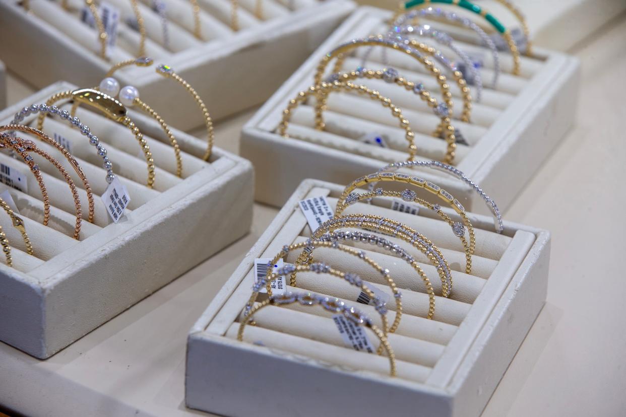 John Baghsarian and Jeffrey Gokey, owners of Earth Treasures, a provider of fine jewelry, display some of their bracelets for sale as they celebrate the store’s milestone 50th anniversary in Eatontown, NJ Friday, April 25, 2024.