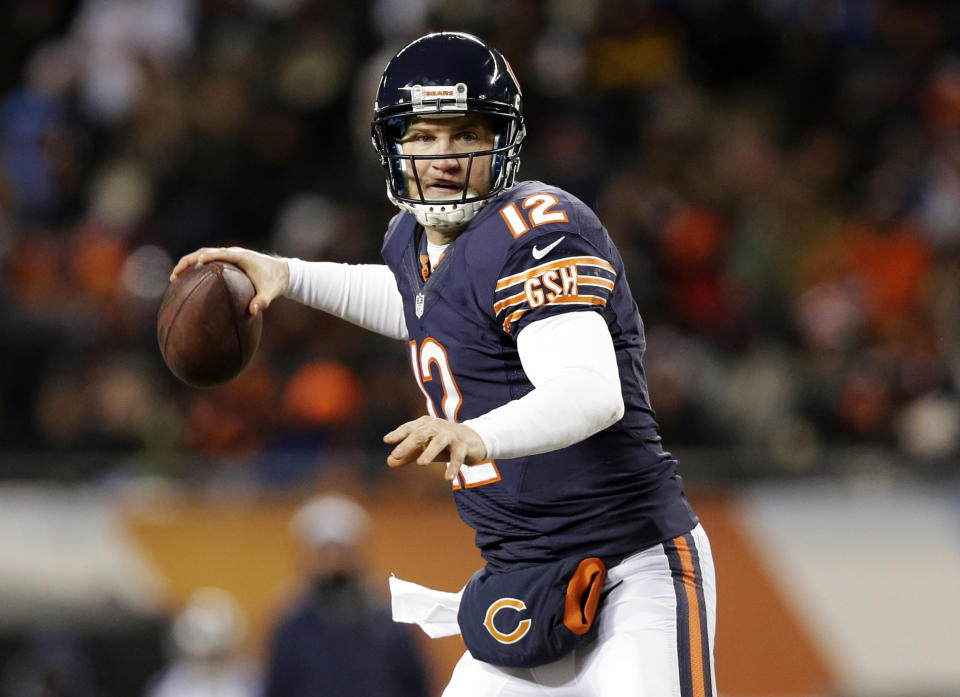 FILE - In this Dec. 9, 2013, file photo, Chicago Bears quarterback Josh McCown prepares to pass against the Dallas Cowboys during the first half of an NFL football game, Monday, Dec. 9, 2013, in Chicago. McCown has agreed to terms of a two-year contract with the Tampa Bay Buccaneers, a move that reunites him with coach Lovie Smith. (AP Photo/Nam Y. Huh, File)