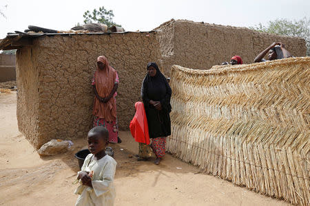 Relatives of missing school girls stand in Dapchi in the northeastern state of Yobe, Nigeria February 23, 2018. REUTERS/Afolabi Sotunde