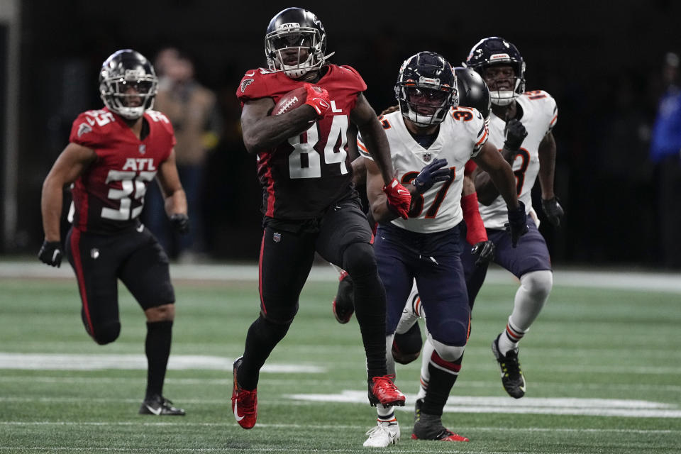 Atlanta Falcons running back Cordarrelle Patterson (84) runs the ball back on a kickoff against the Chicago Bears during the first half of an NFL football game, Sunday, Nov. 20, 2022, in Atlanta. Patterson scored a touchdown on the play. (AP Photo/John Bazemore)