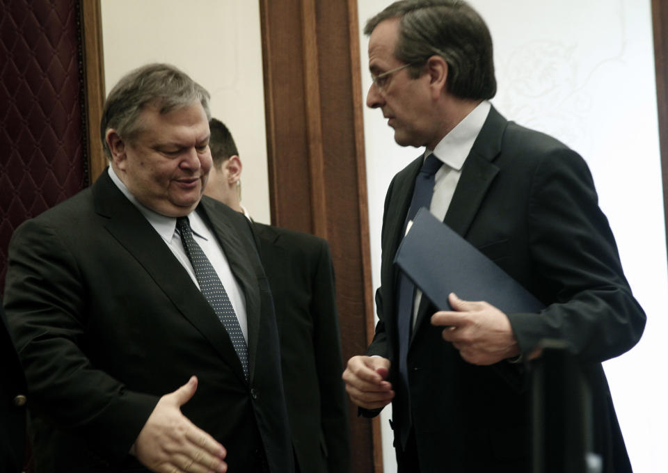 Conservative election winner Antonis Samaras,right, shakes hands with Socialist leader Evangelos Venizelos after their meeting on Friday, May 11, 2011. Greek political leaders are continuing power-sharing negotiations after a May 6 general election gave no party an outright majority to govern. Failure to reach a coalition agreement would trigger fresh general elections next month (AP Photo/Dimitri Messinis)