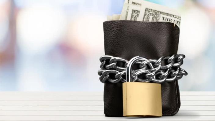 A wallet with a padlock on it.