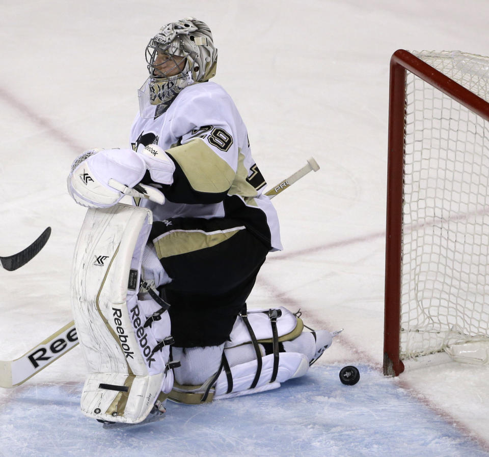 Pittsburgh Penguins goalie Marc-Andre Fleury (29) reacts after being scored against by New York Rangers left wing Carl Hagelin during the first period of Game 6 of a second-round NHL playoff hockey series on Sunday, May 11, 2014, in New York. (AP Photo/Seth Wenig)