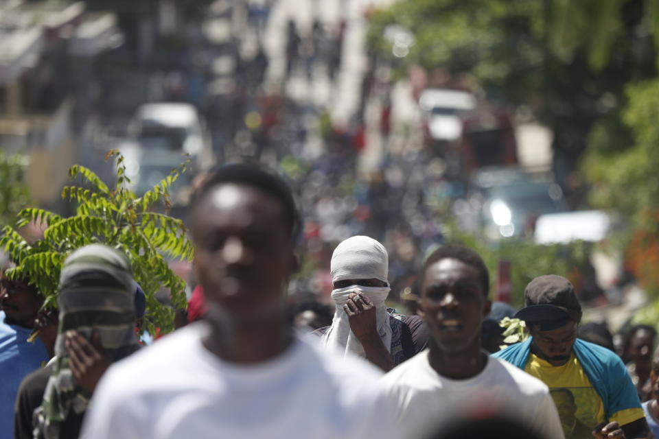 Haitians gather for a nationwide push to block streets and paralyze the country's economy as they press for President Jovenel Moise to give up power, in Port-au-Prince, Haiti, Monday, Sept. 30, 2019. Opposition leaders and supporters say they are angry about public corruption, spiraling inflation and a dwindling supply of gasoline that has forced many gas stations in the capital to close as suppliers demand the cash-strapped government pay them more than $100 million owed. (AP Photo/Rebecca Blackwell)